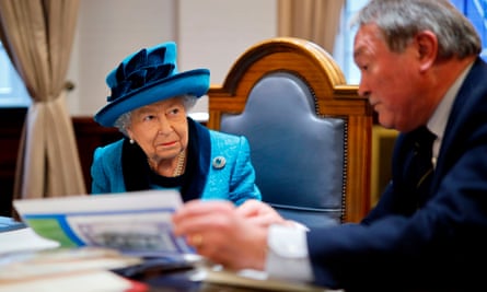 Queen Elizabeth II is shown documents on a visit to the new headquarters of the Royal Philatelic Society in London in 2019.