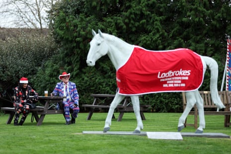 Racegoers in festive dress during day one of the Ladbrokes Christmas Festival at Kempton Park.