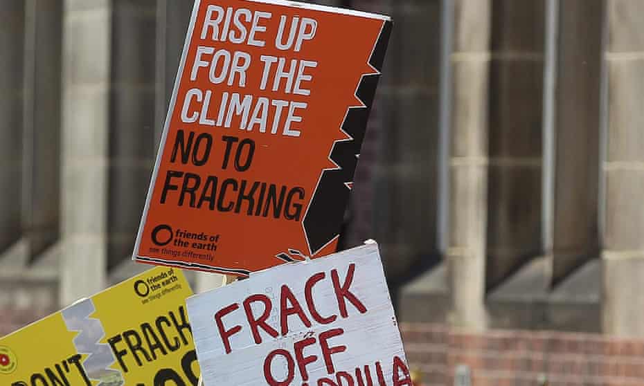 Demonstrators hold anti-fracking signs in Lancashire, north-west England.