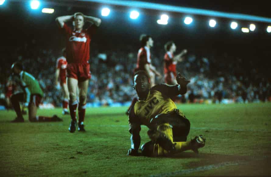 Arsenal’s Michael Thomas celebrates his title-winning goal as Steve Nicol shows his despair at Anfield.