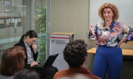 Edith Poor as Lizzie Moyle and Felicity Ward as Hannah Howard (far right) in The Office.
