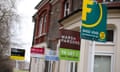 Row of To Let estate agent signs outside houses in London