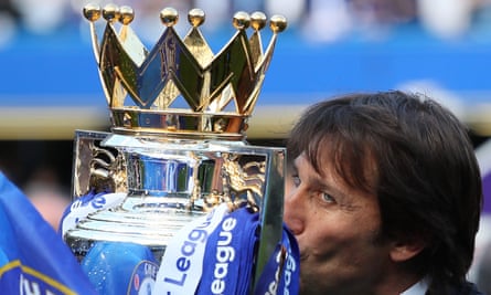 Antonio Conte kisses the Premier League trophy after winning the title in his first season in England.