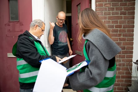 Housing policy advisors Chanda and Muttalip talk to resident Jacob and inform him about his rights under rent regulation.