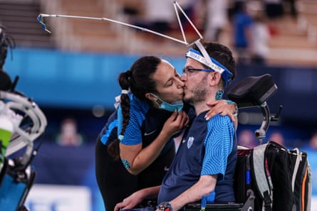 Greece’s Grigorios Plychronidis (R) kisses his assistant Aikaterini Patroni as they compete during the gold medal match in the boccia individual (BC3) competition at the Tokyo 2020 Paralympic Games at Ariake Gymnastics Centre in Tokyo, on September 1