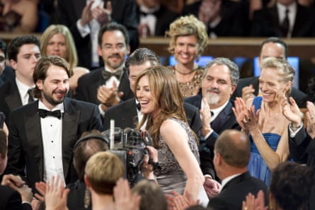 Kathryn Bigelow surrounded by clapping people