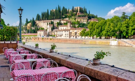 Table by the river: a view of Castel San Pietro.