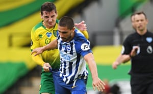 Norwich’s Kenny McLean (left) just before he thought better of laying a hand on Brighton;s Neal Maupay.