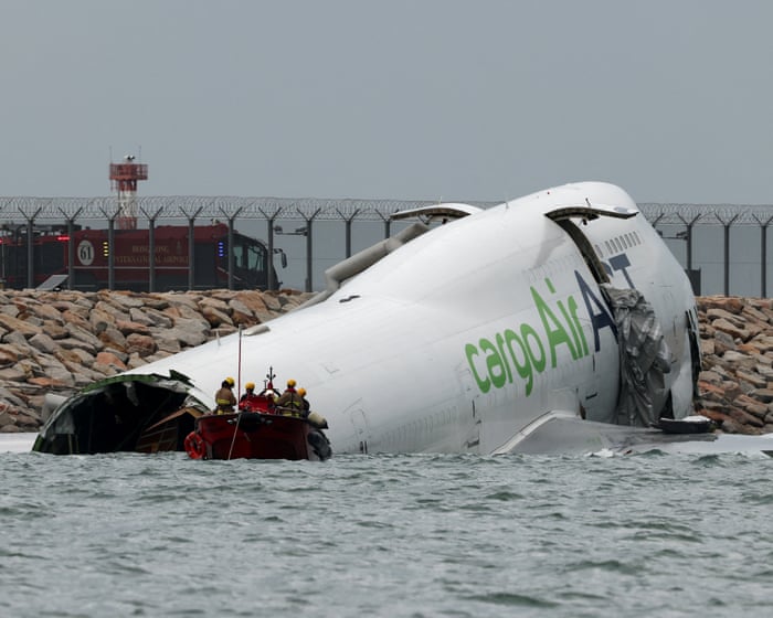 Hong Kong: two people reported killed after cargo plane skids off airport runway