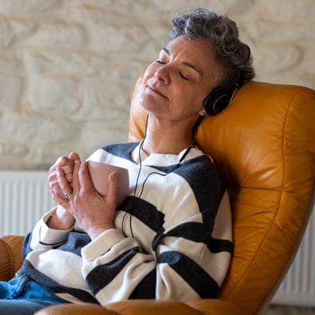 A relaxed woman listening to headphones