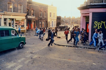 People running from police on the streets or Brixton, London, 11 April 1981