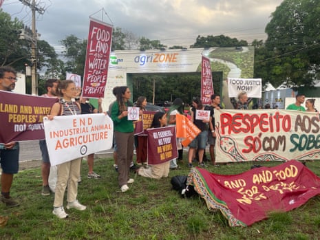 Climate campaigners at COP30 confronted Big Agriculture lobbyists in a protest at the AgriZone, a new zone near the Cop venue dedicated to agribusiness interests and sponsored by corporate giants Nestlé and Bayer.