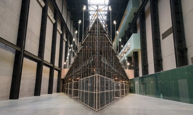 The artwork is held in place by scaffolding
