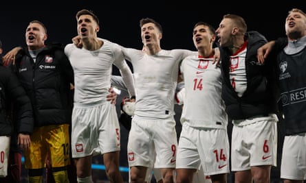 Robert Lewandowski and Poland celebrate knocking out Wales on penalties in Cardiff to reach the finals.