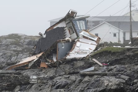 A wooden cabin on the seashore reduced to matchwood