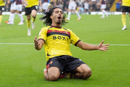 Amin Nabizada slides on the pitch in delight after giving Watford the lead