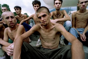 Emaciated Muslim refugees, recently released from a Croat prison in Dretelj, wait for lunch in a grammar school in Jablanica, central Bosnia, 10 September, 1993.