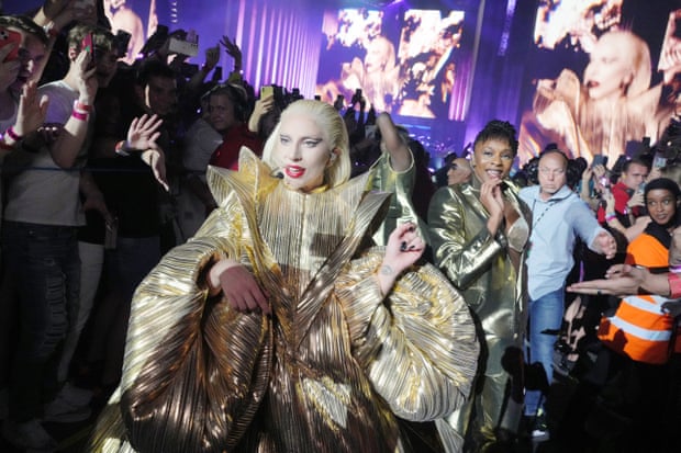 In the throng … Lady Gaga walks to her second stage.