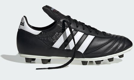 A black Adidas Copa Mundial football boots with white stripes on a white background