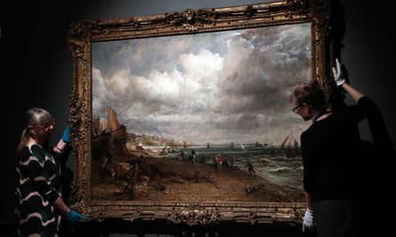 Staff at Brighton Museum &amp; Art Gallery hang a Constable oil for the new exhibition.