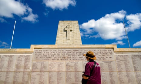 A man looks at a memorial wall in memory of Anzac soldiers who died during and after the Gallipoli campaign.