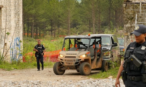 Law enforcement officers guard the entrance of the planed site of a controversial ‘Cop City’ project as the clearcutting of trees begins near Atlanta, Georgia, on Friday.
