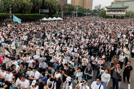 Protesters take part in a rally in support of Ko Wen-je