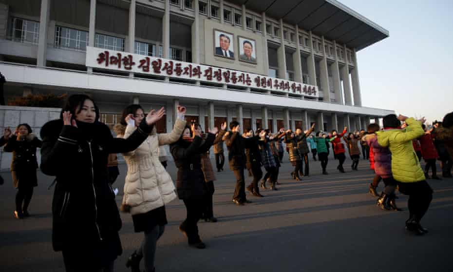 People dance near the Pyongyang Indoor Stadium on Friday to celebrate the nuclear test.