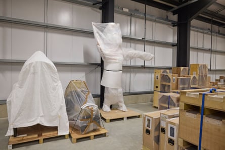 A wrapped Mexican day of the dead sculpture alongside a skidoo and a rickshaw at the British Museum Archaeological Research Collection in Reading.