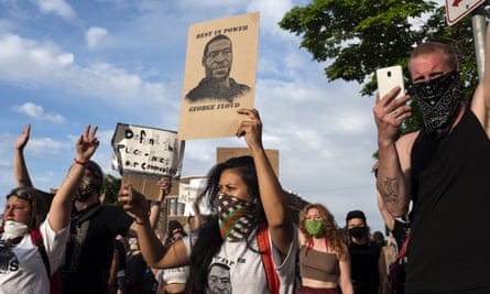 Protesters outside the third police precinct in Minneapolis, Minnesota, on 27 May.