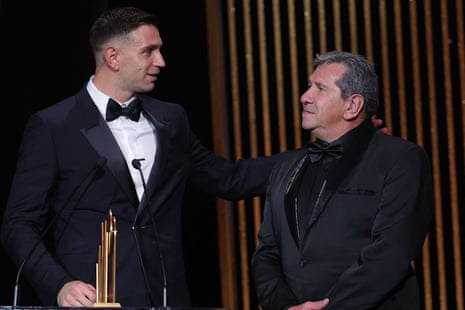 Aston Villa's goalkeeper Emiliano Martinez (left) receives on stage the Yachine trophy for best goalkeeper of the world next his father Alberto Martinez.