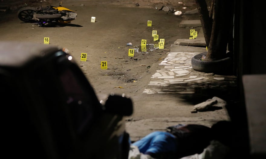 A man lies dead after a shooting in San Pedro Sula, Honduras, on 2 June 2018.