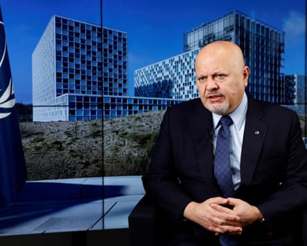 ICC Prosecutor Karim Khan speaks during an interview, seated indoors
