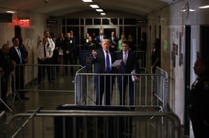 Former US president Donald Trump, alongside his attorney Todd Blanche, speaks to the media as he arrives at the courthouse on Thursday.