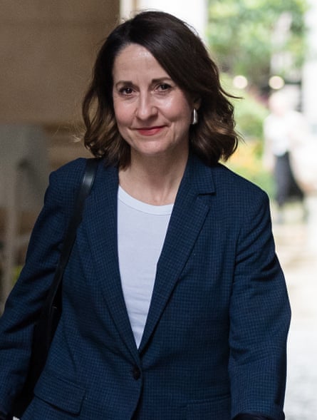 Secretary of state for work and pensions Liz Kendall arrives in Downing Street, 8 October, 2024. Walking down the street wearing a navy suit, dark shoulder-length hair, looking at camera.