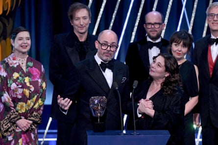 Edward Berger, centre, with Isabella Rossellini, left, and other members of the cast and crew of Conclave, accepting the best film award at this year’s Baftas.