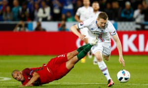 Iceland’s goal-averse forward, Jon Dadi Bodvarsson, shrugs off a routine Pepe challenge.