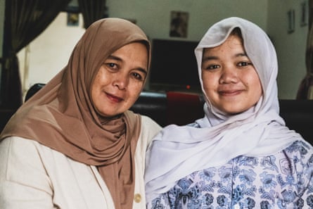 Rini Irawati, with her daughter Nabila, 16, who sustained food poisoning after eating a government-provided free meal in West Java, Indonesia, October 2025.