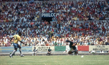 Pelé (left) shoots past Uruguay's goalkeeper Ladislao Mazurkiewicz during the 1970 World Cup semi-final which Brazil won 3-1, and then went on to win the final against Italy. The third one that he won as a player.