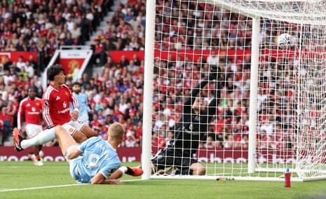 Erling Haaland of Manchester City scores his team’s first goal.
