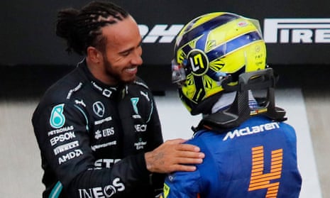 Lewis Hamilton is congratulated by Lando Norris who finished P7 .