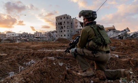 An Israeli soldier takes position in the Gaza Strip.