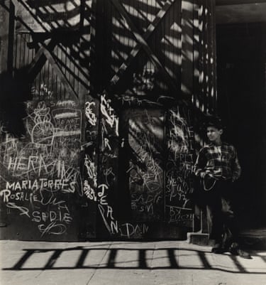 In this image, the graffiti-covered wall, dramatic afternoon light and quietly self-assured figure create a portrait of post-war New York that feels both deeply human and strikingly modern.’ – Alexander Moore, Curator
