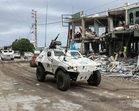 Unifil peacekeepers drive past a destroyed healthcare centre building earlier this month after an Israeli strike in the southern Lebanese town of Burj Qalawiya