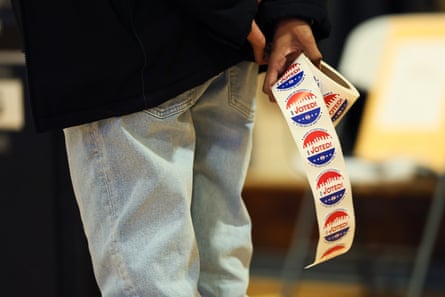 a person holds ‘I voted’ stickers