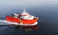 an orange rescue vessel in the sea