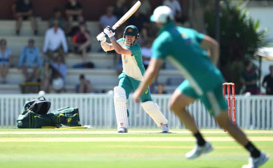 Travis Head has a bat during a rare outdoor Ashes practice session in Brisbane.