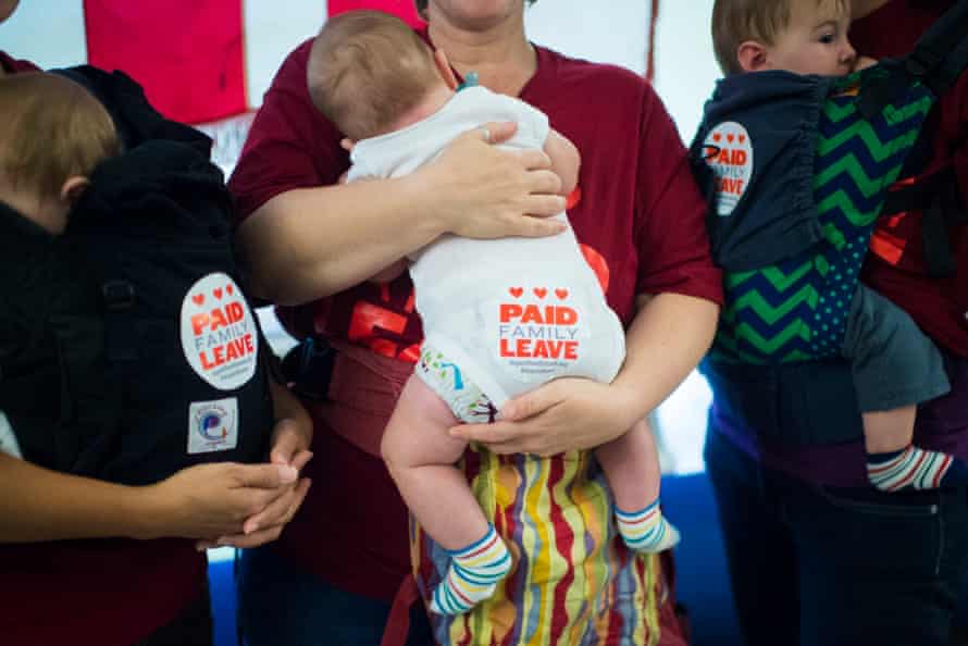 Tanya Snyder holding Milo Evans-Snyder, 5 months old, left, Jessica Champagne holding Benjamin Roth-Champagne, 3 moths old, center, and Jamie Davis Smith holding Adam Smith, 10 months old, right, stand in the hallway after dozens of parents with toddlers and people sat through a DC Council hearing to show support for a paid family leave bill at the John A. Wilson Building in Washington, DC on Tuesday, October 06, 2015.