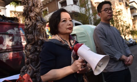 The Uyghur human rights activist Rahima Mahmut, left, and the Hong Kong activist and politician Nathan Law stand outside the Chinese embassy in Rome.