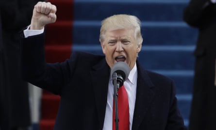 President Donald Trump pumps his fist after delivering his inaugural address.